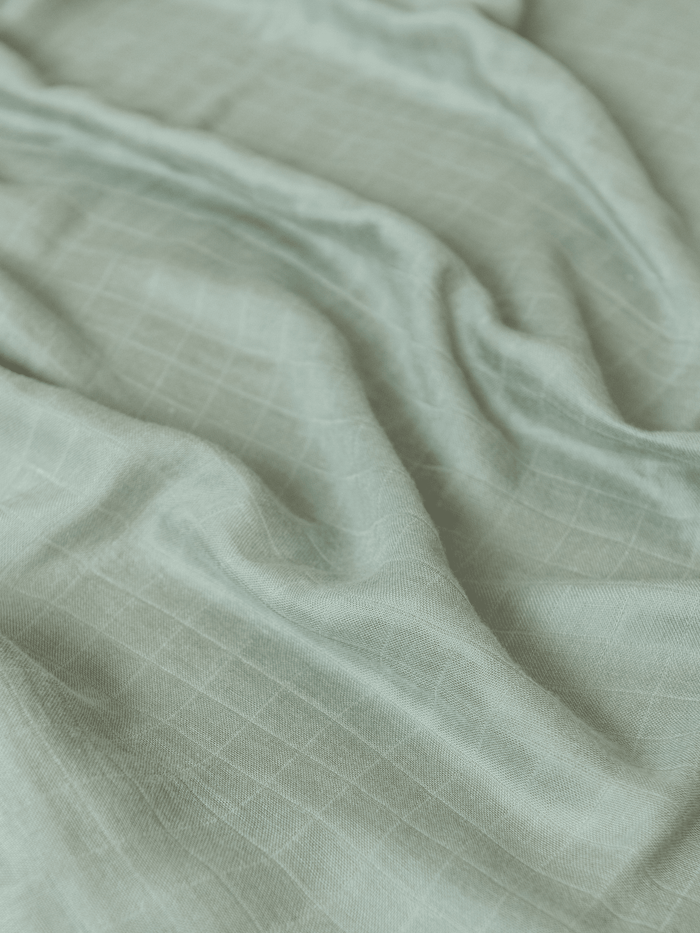 Close up of the airy woven texture of Sage muslin