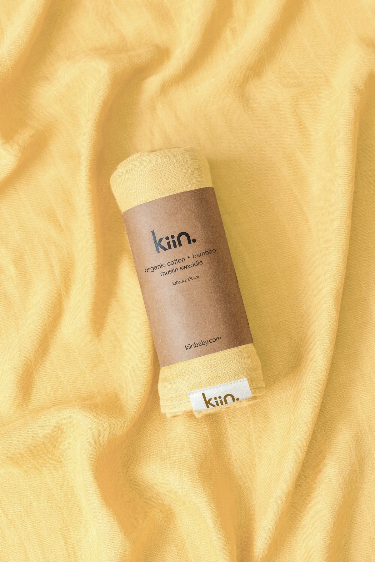 Organic muslin baby swaddle in buttercup yellowsoft newborn essential and baby shower gift. Breathable organic cotton bamboo swaddle for hospital bags and newborn sleep.