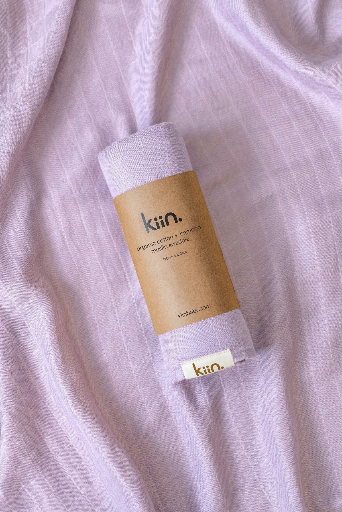 Organic muslin baby swaddle in lilacsoft newborn essential and baby shower gift. Breathable organic cotton bamboo swaddle for hospital bags and newborn sleep.