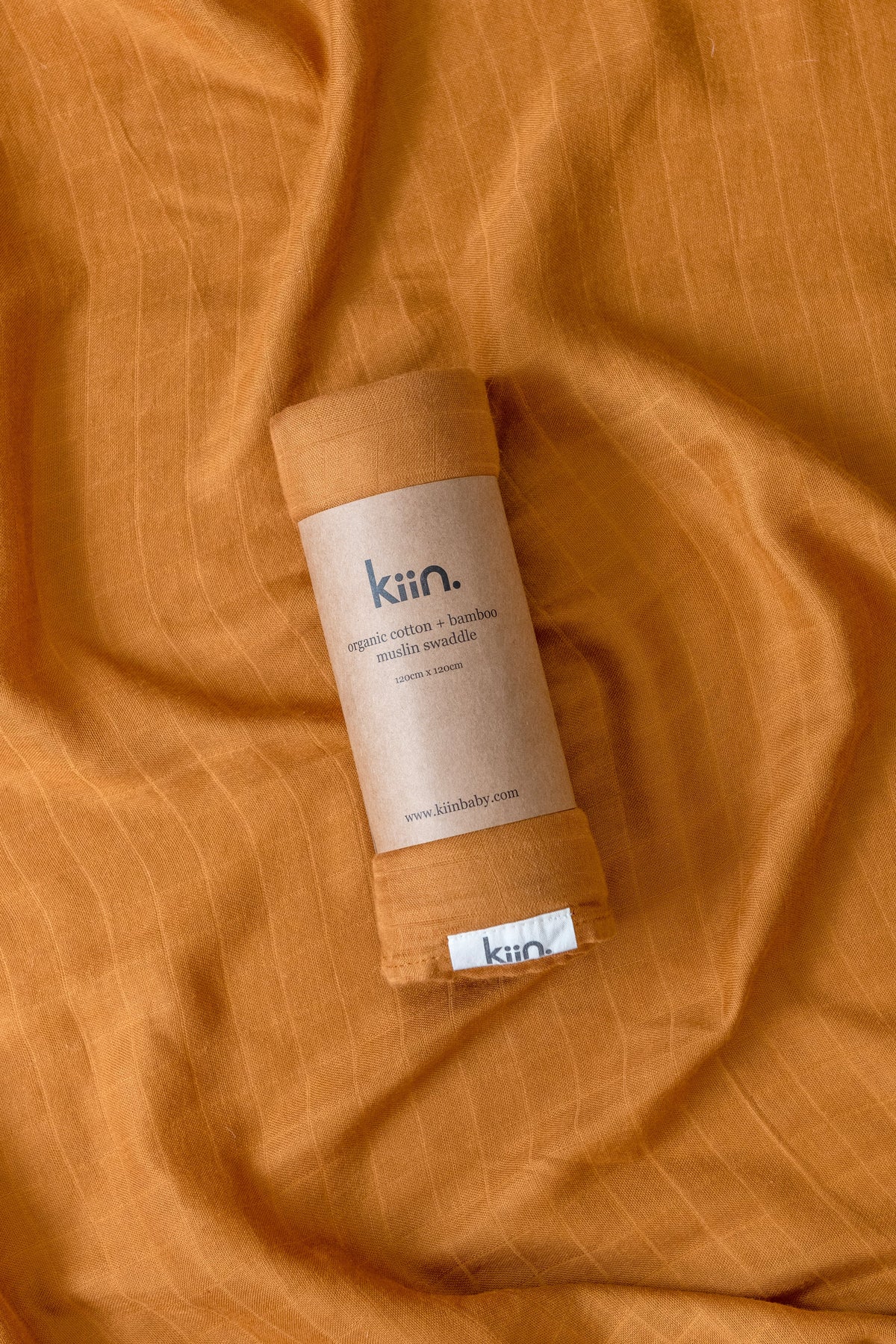 Organic muslin baby swaddle in caramelsoft newborn essential and baby shower gift. Breathable organic cotton bamboo swaddle for hospital bags and newborn sleep.